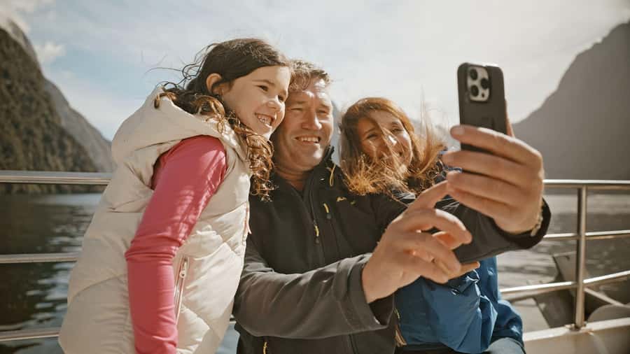 From Queenstown: Coach, Farm Tour & Milford Nature Cruise - Multilingual, app-based commentary plus live guide narration