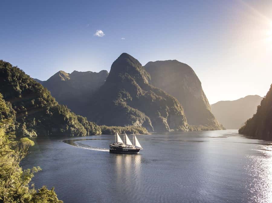 From Queenstown: Doubtful Sound Wilderness Day Trip - Lake Manapouri cruise: calm water before the real fiord