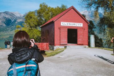 From Queenstown: Glenorchy and Paradise Scenic Half-Day Tour - Glenorchy town time: red shed vibes and Māori stories