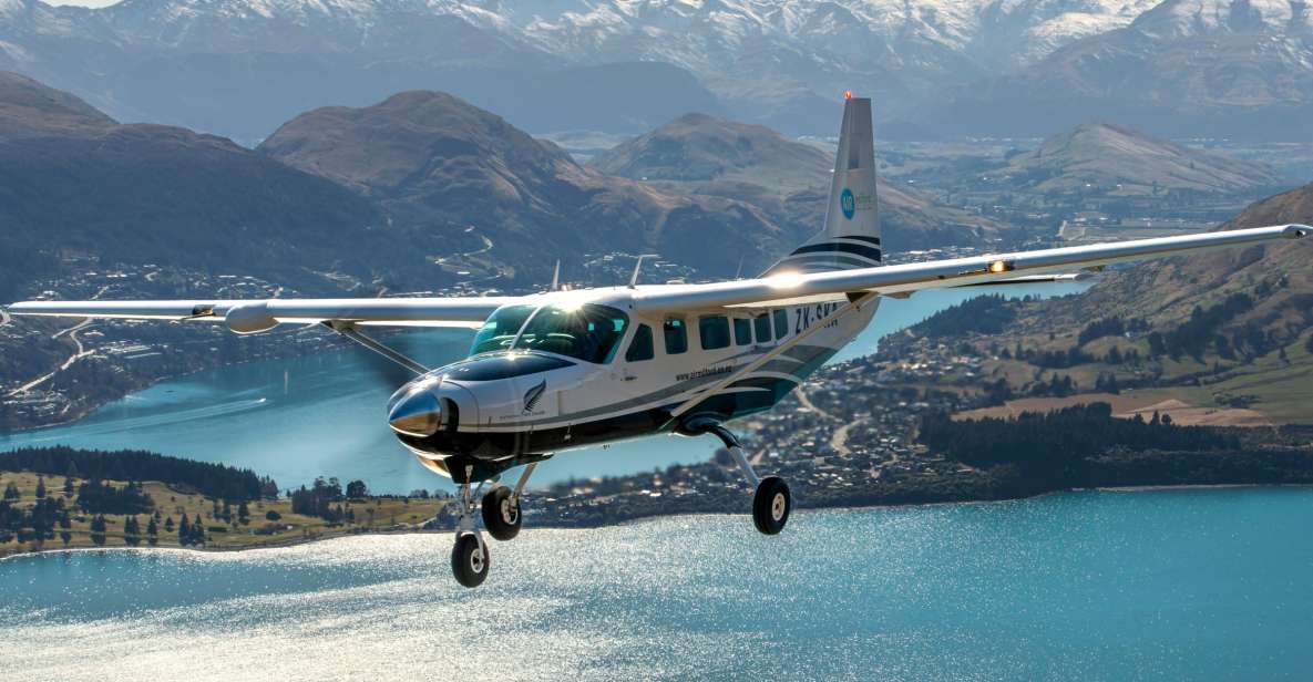 From Queenstown: Milford Sound Flight and Nature Cruise - Milford Sound by small boat: Stirling Falls, cliff walls, and wildlife
