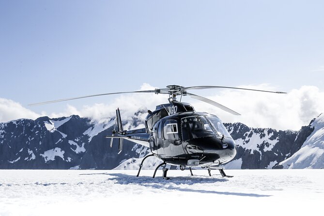 Milford and Fiordland Highlights Tour by Helicopter from Queenstown - Milford Sound from above: waterfalls, rainforest, and the Tasman Sea