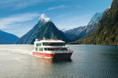 Milford Sound Tour: Cruise & Flight - Entering Fiordland National Park: UNESCO scale, rainforest textures, big peaks